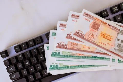 Mixed Cuban CUC currency notes with official denomination values on compute.. Stock-Fotos