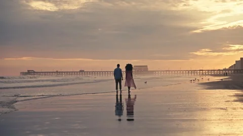 Mixed Diverse Couple Walks On Beach during Sunset East Coast Florida Carolina Stock Footage 280508466
