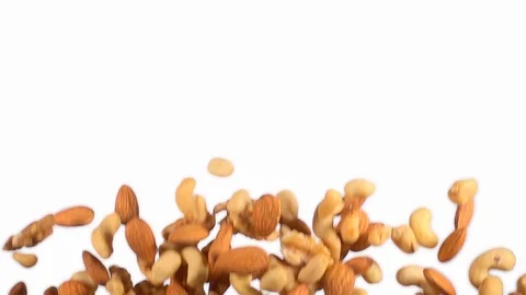 Mixed dried fruit flying in slow motion on white background Stock Footage 118702849
