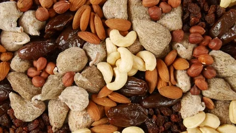 Mixed dried fruit nuts on a plate. Stock Footage 302053042