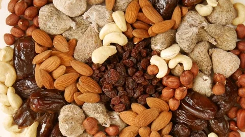 Mixed dried fruit nuts on a plate. Stock Footage 302473239