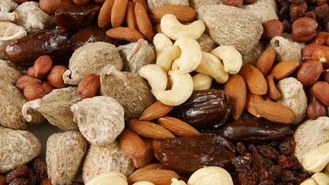 Mixed dried fruit nuts on a plate. Stock Footage 302473266