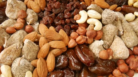 Mixed dried fruit nuts on a plate. Stock Footage 302706980