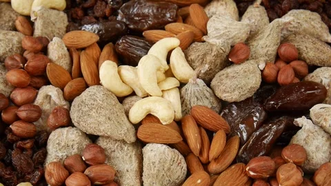 Mixed dried fruit nuts on a plate. Stock Footage 302920452