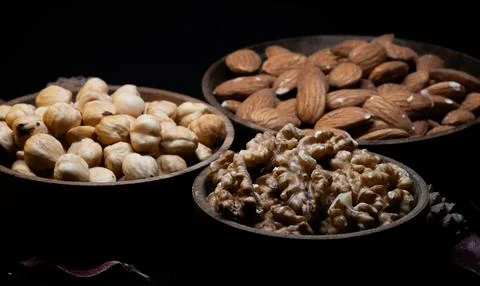 Mixed dried fruit: walnuts, hazelnuts and almonds Stock Photos