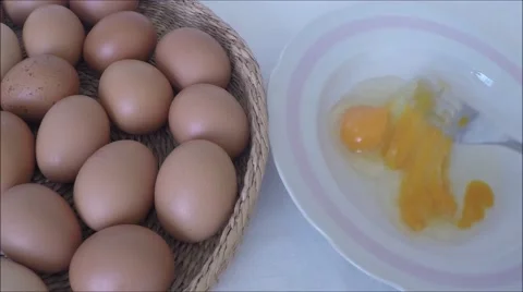 Mixed egg with fork inside plate Stock Footage 46332853