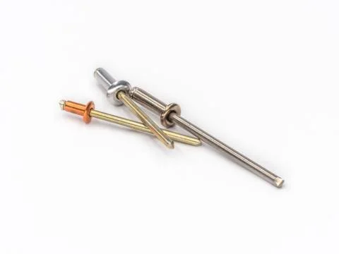 Mixed flat pop rivets with mixed mandrels on white. Stock Photos