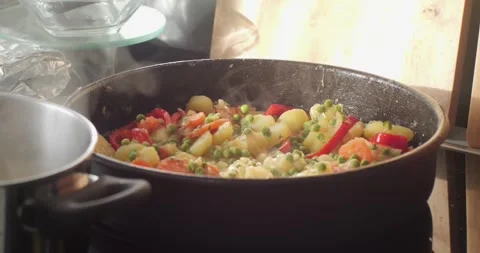 Mixed food on kitchen cooktop elements 4K video Stock Footage 301859849