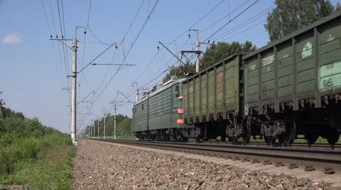 Mixed freight train hauled by an electriuc locomotive Stock Footage 64961326