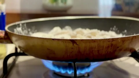 Mixed fried fish cooked in a pan with flour and boiling oil Stock-Footage 328104269