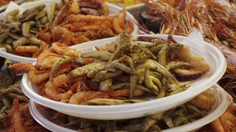 Mixed fried fish. Fish fry, street food. Seafood Stock-Footage 241028231