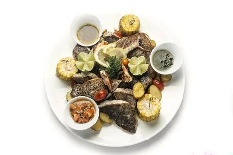 Mixed fried fish plate with seared seabass and red snapper Stock-Fotos