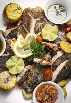 Mixed fried fish plate with seared seabass and red snapper Stock Photos