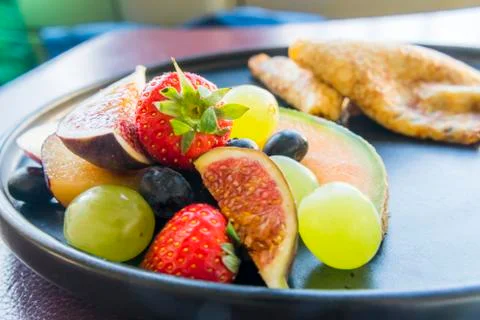 Mixed Fruit for Breakfast on a plate Фото