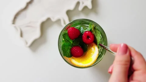 Mixed Fruit Dessert: Spoonful in Clear Glass Stock-Footage 343657557