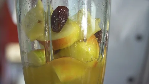 Mixed fruit juice being prepared in the grinder in kitchen Stock Footage 85814792