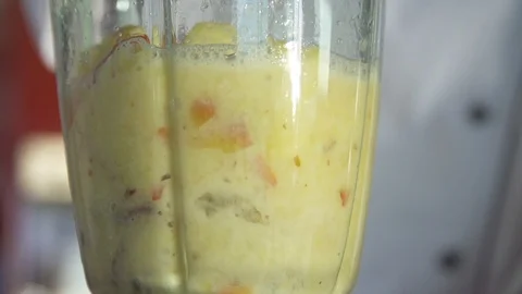 Mixed fruit juice being prepared in the grinder in kitchen Stock Footage 85814808