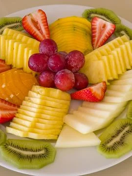 Mixed fruit platter ready to serve as a fresh dessert. Stock-Fotos