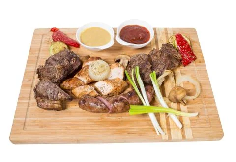 Mixed grilled meats platter. Stock Photos