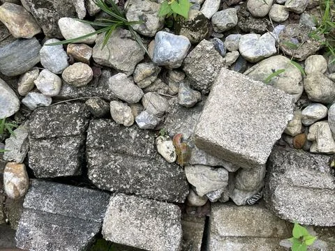 Mixed Ground Of Old Concrete Blocks And Natural Stones Stock Photos
