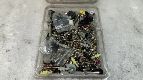 Mixed hardware assortment with screws springs and clips  Video stock 343410198
