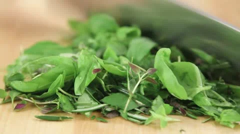 Mixed herbs being chopped Stock Footage 24652000