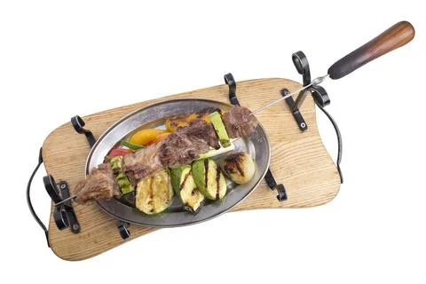 Mixed kebab with vegetables. Stock Photos