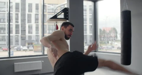 Mixed martial art fighter does shadow boxing and trains at boxing club, fighter Stock Footage 153310522