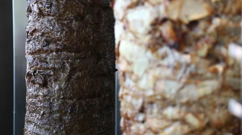 Mixed meats are placed on a spit Stock-Footage 64329357