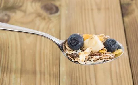 Mixed muesli on a spoon Stock Photos