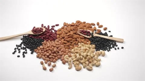 Mixed Nuts and Beans Stop Motion on White Background Stock Footage 336706942