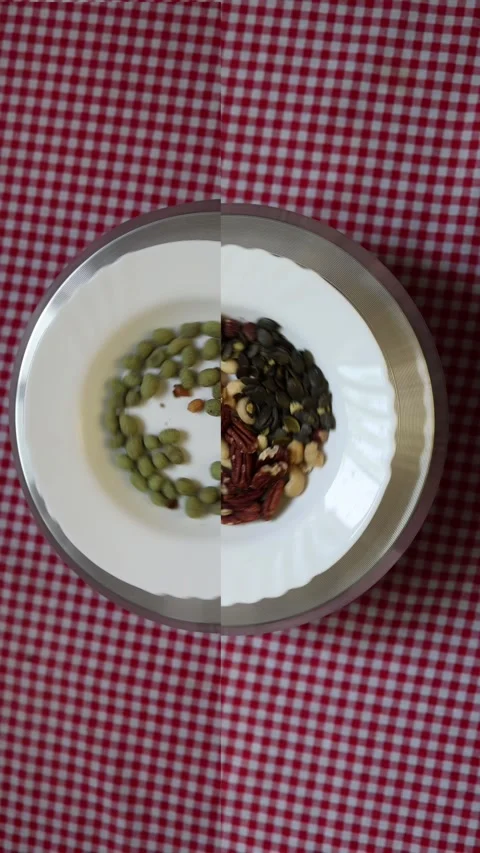 Mixed nuts compare with coated peanuts for healthier snacking Stock Footage 340220308