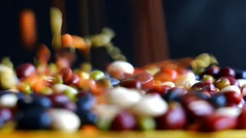 Mixed nuts falling from sky with black background Stock Footage 122729346