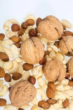 Mixed nuts  -  hazelnuts, walnuts, cashews,  pine nuts Stock Photos