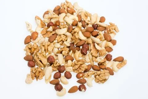 Mixed nuts  -  hazelnuts, walnuts, cashews,  pine nuts Stock Photos
