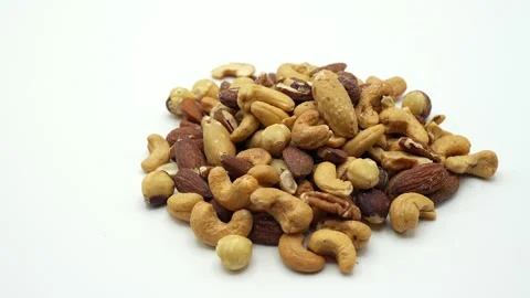 Mixed nuts rotating on white background. 스톡 동영상 237371139