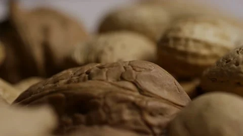 Mixed nuts in shells including peanuts almonds walnuts Stock Footage 328143268