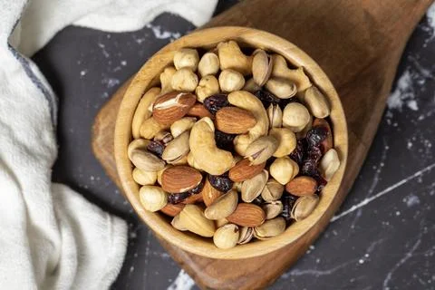 Mixed nuts. Special mixed nuts in wooden bowl. Hazelnut, almond, cashew, pist Stock Photos