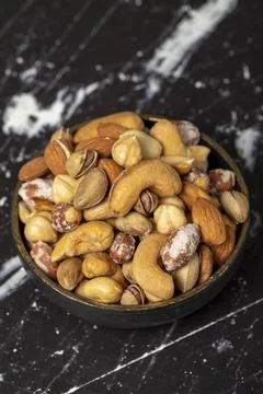 Mixed nuts. Special mixed nuts in bowl. Hazelnut, almond, cashew, pistachio,  Stock Photos