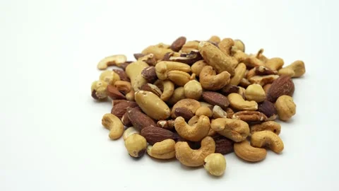 Mixed nuts on white background rotated. Stockbeeldmateriaal 237371141