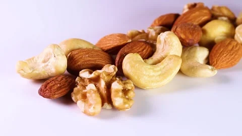 Mixed nuts on white background, rotating Stock Footage 314201964