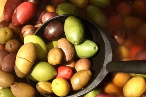 Mixed olives in a ladle Stock Photos
