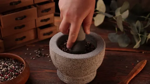 Mixed pepper is crushed in a mortar Stock Footage 199669314