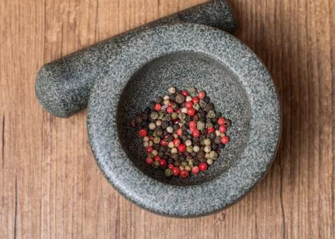 Mixed pepper in mortar Stock Photos