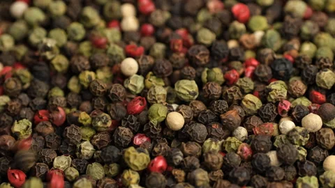 Mixed peppercorn falling down on heap, close up Stock Footage 320836164
