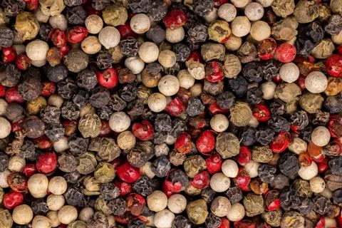 Mixed peppercorns creating vibrant spice food background texture Stock Photos