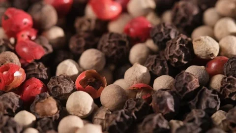 Mixed peppercorns rotation, heap of spice, mix of different peppers closeup Stock Footage 166388239