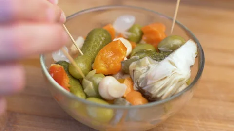 Mixed pickles fallen down in a in glass bowl Stock Footage 145719161