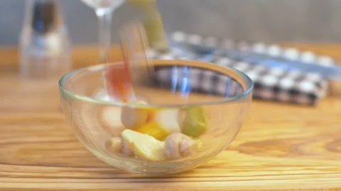 Mixed pickles fallen down in a in glass bowl Stock Footage 145719177