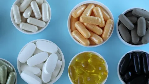 Mixed pill background, top view. Nutritional supplements, vitamins and organic Video stock 229833870